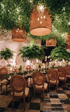 a dining room with tables and chairs covered in plants