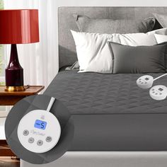 a bed with an alarm clock on it