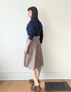 "Vintage Pleated Plaid Skirt  era: 1970s Polyester Wool Acrylic blend  Made in Canada by Paris Star Tag reads \"14\" Below the Knee Length Cut High Waisted Elastic Waist Band Good Vintage Condition. The pleats are no longer crisp and the waistband is starting to lose stretchiness, still cute and wearable. MEASUREMENTS Waist 28\" to 32\" Hips 60\" (full) Length 27\" MODEL MEASUREMENTS: HEIGHT 5' 4\" BUST 34\" WAIST 28\" HIPS 36\" Combine multiple items to save on shipping!  Be sure to check out our shop policies!" Vintage Pleated Bottoms For Fall, Vintage Pleated Skirt For Workwear In Fall, Vintage Pleated Fall Skirt For Workwear, Vintage Full Pleated Skirt For Fall, Vintage Pleated Skirt For Fall, Vintage Lined Skirt For Fall, Vintage Skirt For Fall, Retro Fall Skirt For Vintage Fashion, Vintage Knee-length Relaxed Skirt