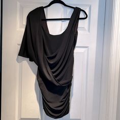 Asymmetrical Black Bcbgmaxazria Dress. Never Worn, Tags Still On Flowy Sleeveless Party Dress, Drapey Sleeveless Party Dress, Chic Drapey Dress For Evening, Drapey Evening Dress, Elegant Party Dresses With Drapey Fit, Elegant Drapey Dresses For Parties, Chic Asymmetrical Drapey Dress, Black Draped Midi Evening Dress, Sleeveless Drapey Evening Dress