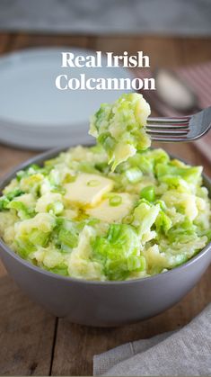 a spoon full of mashed potatoes and broccoli