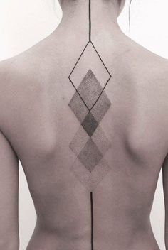 the back of a woman's neck with geometric designs on it