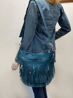 Dark Teal Fringe Boho Crossbody Bag Handmade in Australia *  Strong, soft genuine leather, with braiding feature  *  3 x inside pockets, leather edged and riveted *  1 outside Back zipper pocket *  Strong adjustable strap with solid antique buckle. *  Easy slide zipper closure.    - Fully lined - choose lining from photo - HARDWARE OPTIONS: Antique brass or silver (Shown in photos) SIZE: -  W36cm (13.8 inch) across top, H29cm (11.4 inch)  Height with fringe 32cm (12.6 inch) -  Strap: Adjustable to 128cm (50 inch), Width 3.5cm (1.4 inch)  I can make a custom order from this style eg in brown leather. Message me to discuss. Black fringe bag is available here https://www.etsy.com/au/listing/1181764110/black-double-fringe-bag-shoulder WORLDWIDE SHIPPING I have some exciting discounts, freebies Double Fringe, Boho Crossbody Bag, Fringe Bags, Hobo Bags, Boho Braids, Black Fringe, Deep Teal, Bag Handmade, Dark Teal