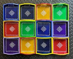 a multicolored tray with nine different designs on it