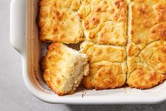 a casserole dish with biscuits cut into squares