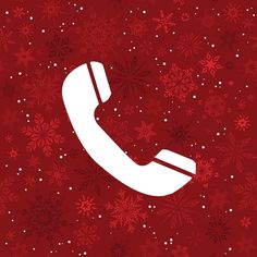 an old phone on a red background with snowflakes