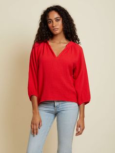 A modern version of the peasant style top in effortless, breezy Double Gauze. Elastic at 3/4 length voluminous sleeve. Raw hem. (This one comes in Cherrybomb.) | Women's Mimi Blouse Top in Cherrybomb | Ethical Essentials Versatile Relaxed Fit Tops For Brunch, Daywear Tops With Blouson 3/4 Sleeves, Daywear Tops With Blouson Sleeves And 3/4 Sleeve, Fall 3/4 Sleeve Tops For Brunch, Versatile Summer Top With 3/4 Sleeves, Summer Tops With Blouson 3/4 Sleeves, Casual Top With Blouson 3/4 Sleeves, Casual Blouson Sleeve Top, Casual Tops With Blouson 3/4 Sleeves