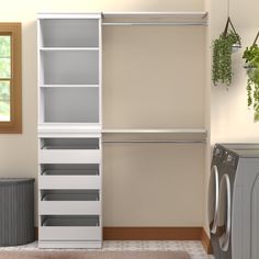 an empty laundry room with dryer and washing machine