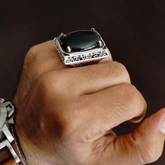 925 STERLING SILVER MEN'S RING WITH BLACK ONYX Designed and handcrafted in Turkey Quality meets perfection! Bold & Elegant METAL : .925 Sterling Silver STONE: Onyx STONE DIMENSIONS: 28 x 32 mm TOTAL WEIGHT: 45 g SIZE: US 11 *for other sizes please leave a note during order Unique Black Engraved Ring, Black Artisan Jewelry With Polished Finish, Artisan Black Jewelry With Polished Finish, Artisan Black Sterling Silver Rings, Unique Black Signet Ring For Anniversary, Unique Black Engraved Signet Ring, Artisan Black Round Ring, Handmade Black Sterling Silver Signet Ring, Unique Black Rings With Polished Finish