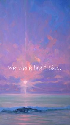 we were born sick painting on canvas with words above the ocean and sunset in background