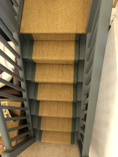 the stairs are lined with jute carpet