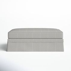 a striped box sitting on top of a white surface