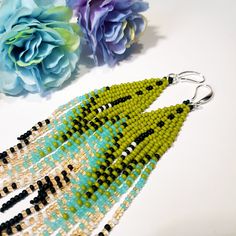 "Seed Bead Earrings 5 inch long.Flowing beads earrings.Bohemian dangle beaded earrings. with fringe are made of high quality Czech and Japanese seed beads.V long earrings.Bead weaving techniques. Colors: Green khaki,black,peach,turquoise. ! Details ! Made with quality Japanese and Czech seed beads ! Professional threads for weaving with beads Tytan and Fireline. ! Length 5 inches ( 13cm) ! Sterling silver plated ear wire. Simple sterling silver ear wire 925 are included with each earrings. ! Wei Green Dangle Tassel Earrings For Summer, Green Fringe Earrings For Summer, Bohemian Green Long Drop Earrings, Green Bohemian Beaded Dangle Earrings, Unique Green Beaded Dangling Earrings, Green Beaded Bohemian Chandelier Earrings, Bohemian Green Chandelier Earrings With Ear Wire, Bohemian Green Chandelier Earrings With Colorful Beads, Green Bohemian Chandelier Earrings With Colorful Beads