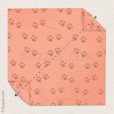 the pattern is cut out to look like an animal's paw prints on pink paper