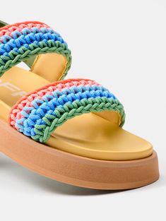 The most authentic and colorful version of the Road. The MULTICOLOR GALDANA sandals have a dose of color that makes them the most desired by everyone this season. Their woven details in shades of green, blue, and orange express the essence of summer. Their molded insole, elevated rubber soles, and open-back silhouette make them perfect for walking around your favorite city, going to work, or meeting up with your friends. Ideal for adding a pop of color to any outfit, pair them with the Macarella Green Flat Sandals With Woven Sole, Spring Green Sandals With Woven Sole, Green Open Toe Sandals With Woven Sole, Green Sandals With Woven Sole For Beach, Multicolor Sandals With Removable Insole For Summer, Multicolor Summer Sandals With Woven Sole, Multicolor Sandals With Cushioned Footbed For Vacation, Multicolor Woven Open Toe Sandals, Multicolor Platform Sandals For Beach