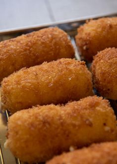 some fried food is cooling on a rack