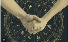 two people holding hands in front of an astro wheel with zodiac signs on it and stars