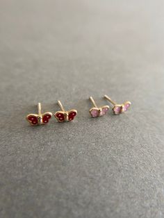 SCREW BACK/14K Solid Gold Butterfly Stud Earrings- 14K Solid Gold Quantity: One Pair Color : Red / Pink Materials : 14K Solid Gold Size : 3.5mm * 6mm *14K Solid Gold will not tarnish. *Good for sensitive skin. * Metal components are 14K Solid Gold including earring backs. * Suitable for delicate and sensitive ears. * Comes in a jewelry box. If you need extra boxes for gifting....just let us know! Red 14k Gold Pierced Earrings, 14k Gold Red Earrings For Pierced Ears, Dainty Red 14k Gold Earrings, Red 14k Gold Earrings, Dainty Pink 14k Gold Earrings, Butterfly Earrings Gold, Oval Stud Earrings, Baby Earrings, Tiny Hoop Earrings