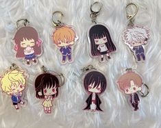 six key chains with anime characters on them