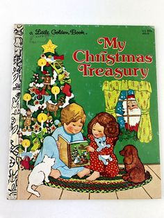 an old children's book with the title, my christmas treasury written on it