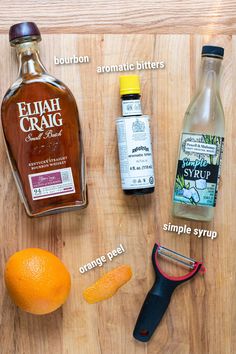 ingredients to make an orange syrup recipe laid out on a cutting board