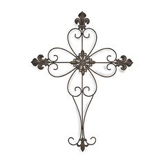 an iron wall cross is shown on a white background