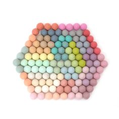 several colored balls arranged in the shape of a heart