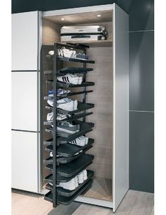 the closet is full of shoes and other items in it's storage compartment,