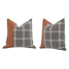 two gray and brown plaid pillows on white background