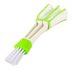 three white and green toothbrushes sitting on top of each other