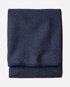 a blue scarf folded on top of a white background