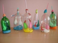 there are many small bottles with toothbrushes in them