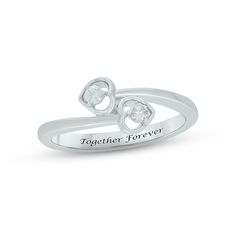 This sweet and meaningful promise ring is a sparkling symbol of your commitment. A round diamond sparkles in each heart-shaped setting at the center. Crafted in sterling silver, the inside of the band is engraved with a message of your choosing – up to 16 letters in length – for a personal touch. The ring has a total diamond weight of 1/10 carat. Heart Engagement Ring, Heart Engagement, Heart Promise Rings, Heart Engagement Rings, Sterling Silver Wedding Rings, Silver Diamond Ring, Silver Engagement Ring, Diamond Heart Ring, Heart Motif