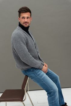 "Pure merino wool knitted mens sweater is inspired by classic Scandinavian style. Simple jumper has V neck, buttons closure. Warm and comfortable woolen sweater delivers simplicity, style and ability to wear this sweater whenever you are spending time in nature or going to the theater, restaurant with your family or friends. This year we are inviting customers to buy Christmas presents from small family businesses & stand together during this crazy time. Handmade Christmas presents will be e Classic Knitted V-neck Sweater For Winter, Classic Gray Polo Sweater For Winter, Classic Gray Knitted Sweater, Classic Gray Winter Polo Sweater, Grey Jumper Outfit, Classic Gray Knit Cardigan, Classic Gray Wool Cardigan, Casual Gray Merino Wool Sweater, Men’s Knitted Jumper Outfit