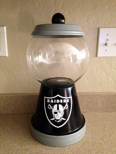 a football helmet gumper machine sitting on top of a counter