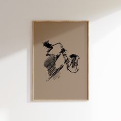 a black and white drawing of a bicycle on a beige wall above a wooden frame