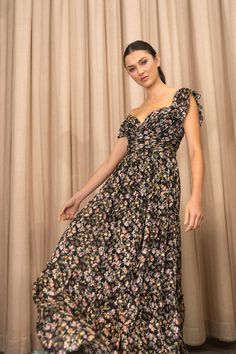 The Naia dress makes a beautiful statement for any special occasion. Cut in our beautiful new silk blend Topiary floral burnout fabric, she features a deep sweetheart neckline and versatile ruffle sleeves that can be worn on or off the shoulder. Pleating details in the structured bodice and gathered tiers in the skirt add further interest to this striking style. Details: - Topiary Floral Burnout fabric- Deep sweetheart neckline- Bust cups- Boning- Ruffled strap can be worn on or off the shoulder Burnout Fabric, Jenny Yoo, Ruffle Sleeves, Sweetheart Neckline, Black Floral, Dress Making, Off The Shoulder, Bodice, Special Occasion