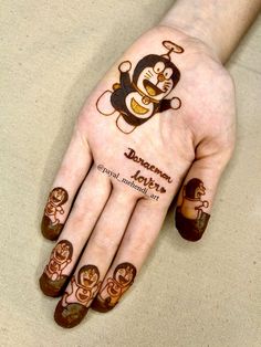 a person's hand with tattoos on it and the words monkey written in arabic