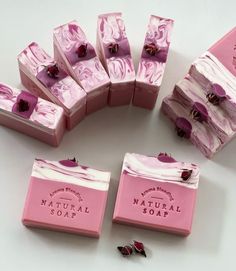 several soap bars with pink flowers on them