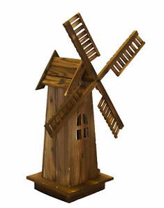 a wooden windmill is shown on a white background