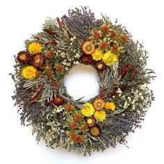 a wreath made out of dried flowers and herbs