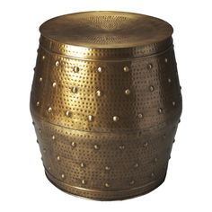 a gold metal stool with rivets on it