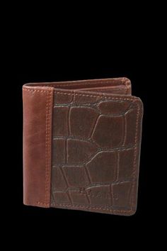 This strikingly Crocodile embossed wallet by HAANS is handcrafted using Munich tanned leather. This bifold wallet is a classic and practical accessory with multiple pockets. DIMENSIONS: L 8.5 W 0. 6 " H 3.5" Leather Bifold Card Holder With Crocodile Pattern, Leather Wallet With Crocodile Pattern For Daily Use, Leather Bifold Wallet With Crocodile Pattern, Brown Embossed Wallets For Daily Use, Brown Embossed Wallet For Daily Use, Daily Use Leather Wallet With Crocodile Pattern, Brown Embossed Wallet, Brown Embossed Leather Wallet, Clip Wallet