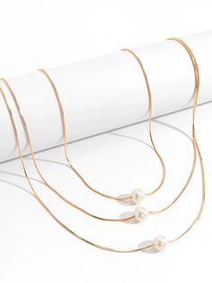 Simple Multilayer Pearl Necklaces – Timeless Elegance for Every Occasion White Double Strand Layered Jewelry, White Layered Double Strand Jewelry, White Multi-strand Layered Necklace With Pearl Chain, White Multi-strand Layered Pearl Necklace, White Double Strand Pearl Chain Layered Necklace, White Pearl Double Strand Layered Necklace, White Double Strand Pearl Layered Necklace, White Multi-strand Delicate Chain Jewelry, White Multi-strand Jewelry With Delicate Chain