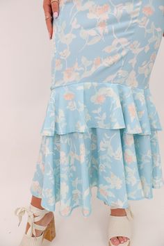 Indulge in the feminine and flirty style of our Blue Floral Skirt Set! This form-fitting set features a square neckline top with adjustable shoulder ties for the perfect fit, while the fitted mermaid skirt boasts a tiered flounce hem for added flair. Perfect for your next special occasion, you're sure to turn heads in this little number! Blue Floral Skirt Set Fitted Square neckline fitted top Adjustable shoulder ties Side zipper High waisted mermaid midi skirt Tiered flounce hem Zippered back If Mermaid Midi Skirt, Square Neckline Top, Flirty Style, Skirt Tiered, Blue Floral Skirt, 2 Piece Skirt Set, Mermaid Skirt, Fitted Top, Short Leggings