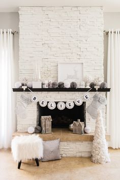 a living room decorated for christmas with white decorations