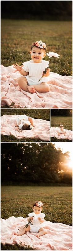 a baby sitting on top of a blanket in the grass