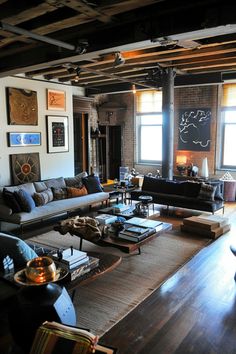 a living room filled with lots of furniture next to two windows and a wooden floor