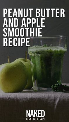 there is a green smoothie next to two apples