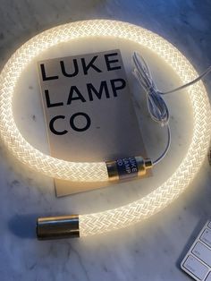 an electronic device that is sitting on a table with the words luke lamp co in front of it